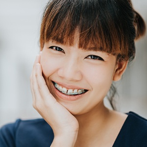 Woman smiling during adult orthodontic treatment