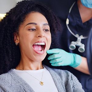 Orthodontist in Enfield reviewing ceramic braces options with patient