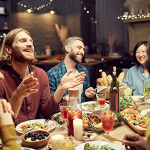 A group of young people gathered for a meal at a home